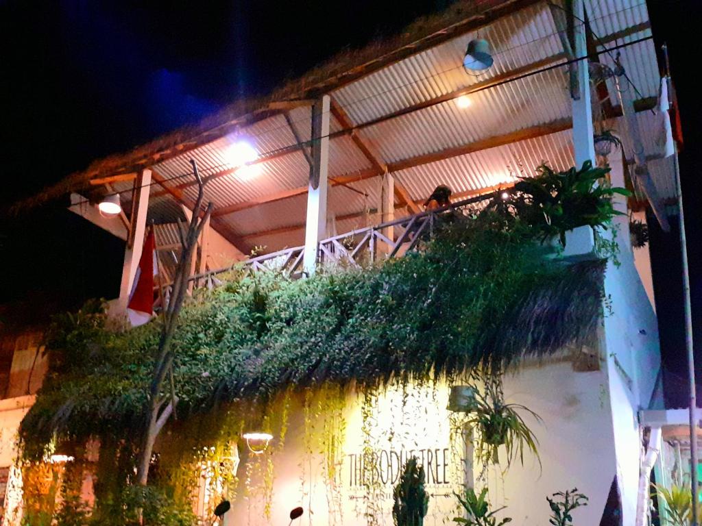 a balcony with plants on the side of a building at The Bodhi Tree Karimunjawa in Karimunjawa