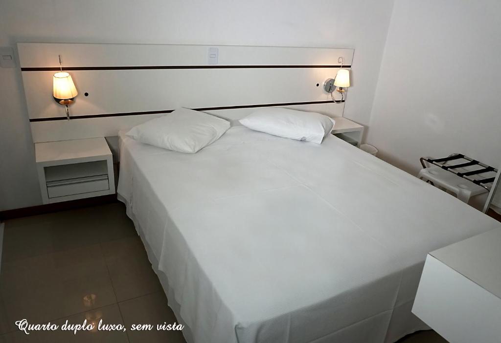 Postel nebo postele na pokoji v ubytování Pousada Molhes da Barra