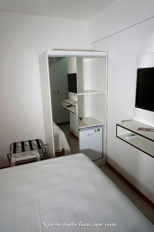 Postel nebo postele na pokoji v ubytování Pousada Molhes da Barra