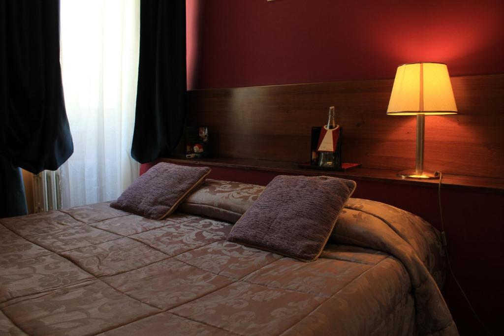 Postel nebo postele na pokoji v ubytování Hotel San Lorenzo
