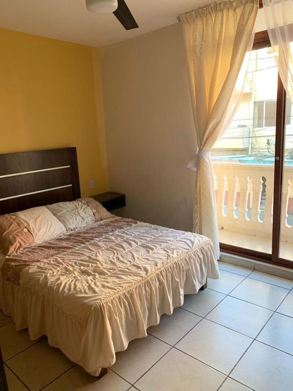 Postel nebo postele na pokoji v ubytování Hotel Posada San Juan