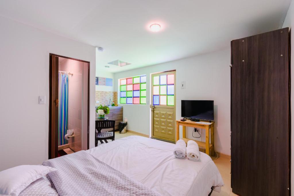 Postel nebo postele na pokoji v ubytování Hostal Doña Eliza