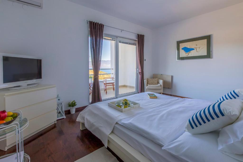 Postel nebo postele na pokoji v ubytování Villa Vrbnik