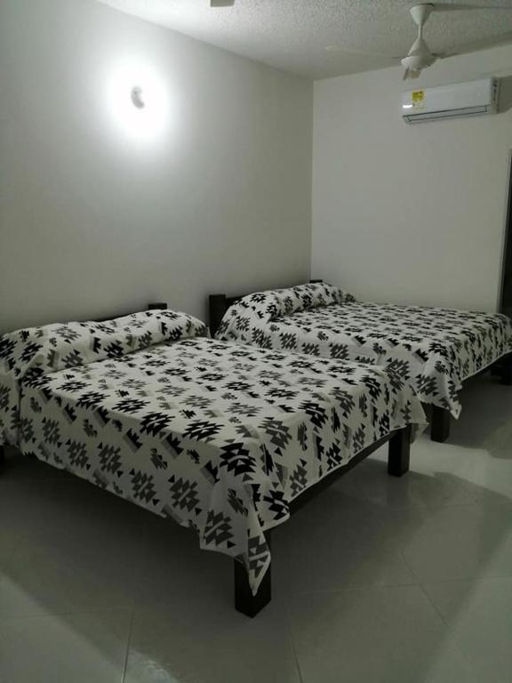 Postel nebo postele na pokoji v ubytování HOTEL TANIA