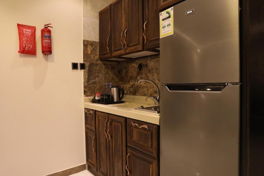 Kuchyň nebo kuchyňský kout v ubytování Al Mokhtar 2 Furnished Units