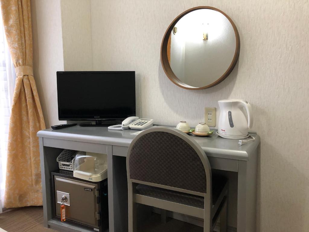 TV a/nebo společenská místnost v ubytování Hotel Belle-Cour Inomata