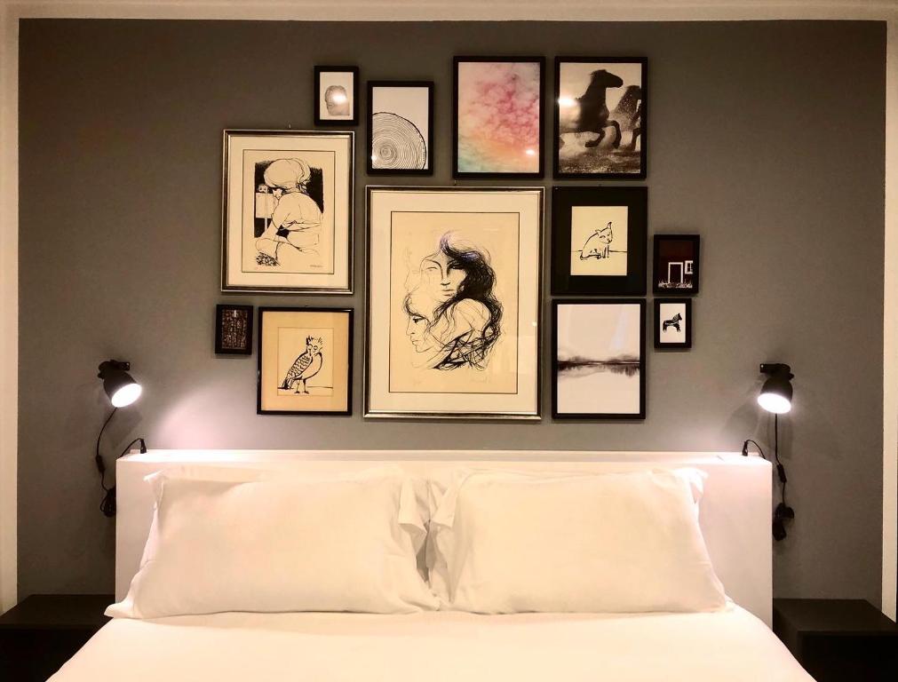 Posteľ alebo postele v izbe v ubytovaní Mimì Rooms&Studios