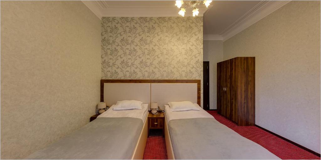 Postel nebo postele na pokoji v ubytování Hotel Avlabari