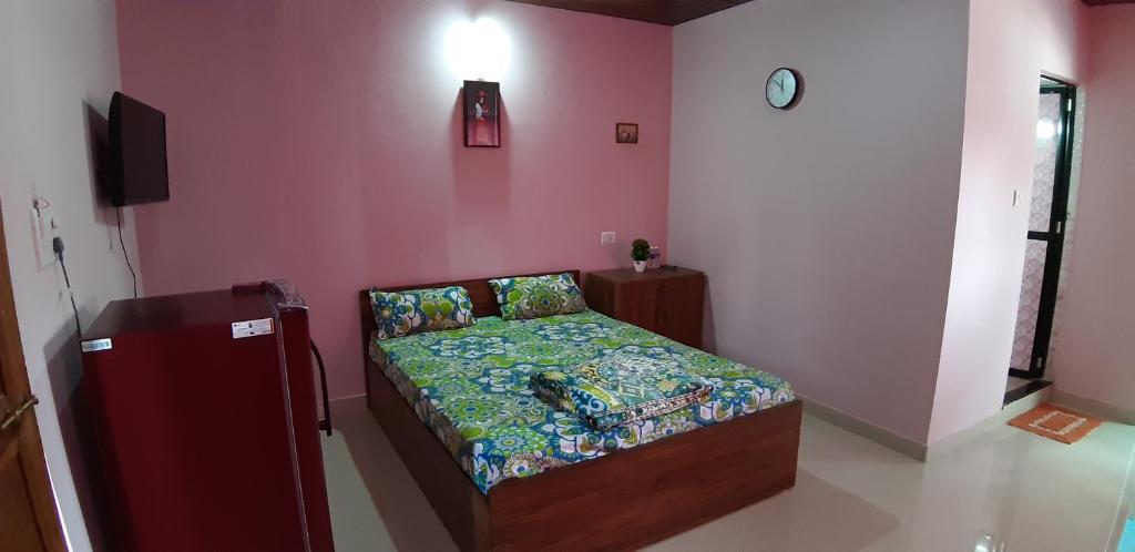 Postel nebo postele na pokoji v ubytování Noel Guest House