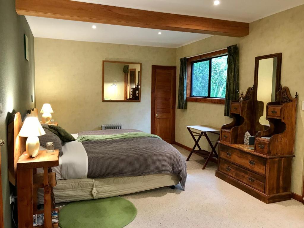 Letto o letti in una camera di Murchison Lodge