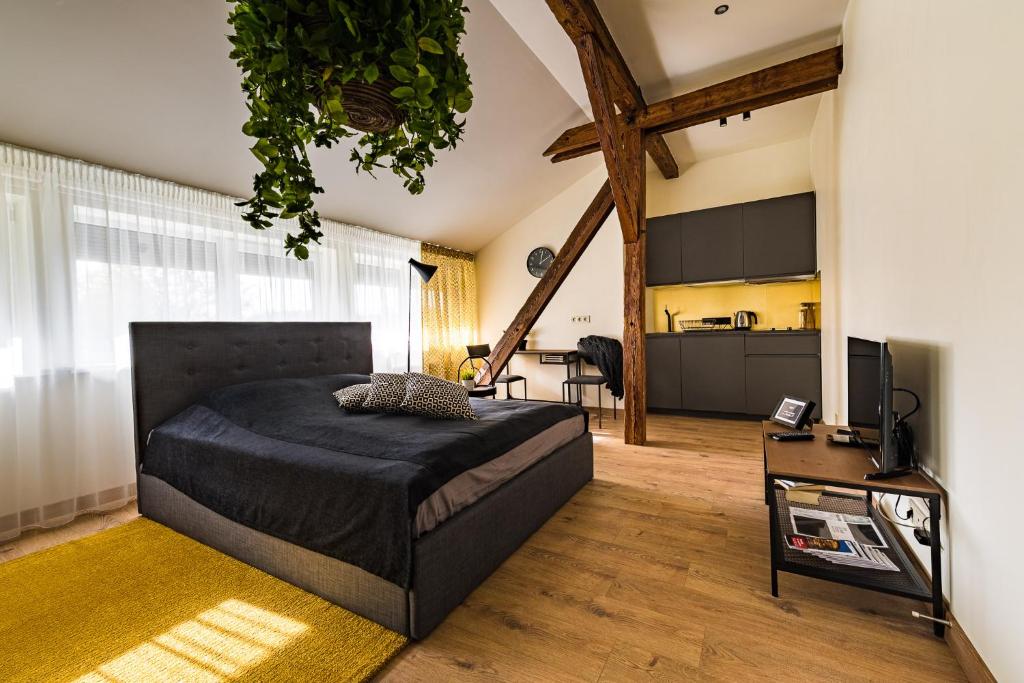 Кровать или кровати в номере Liepaja Apartments