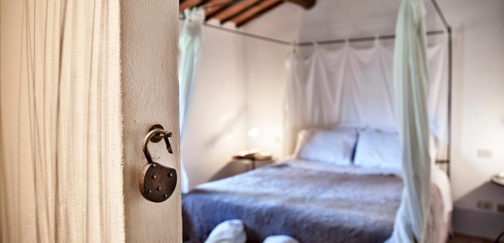 Postel nebo postele na pokoji v ubytování Podere Poggio al sole