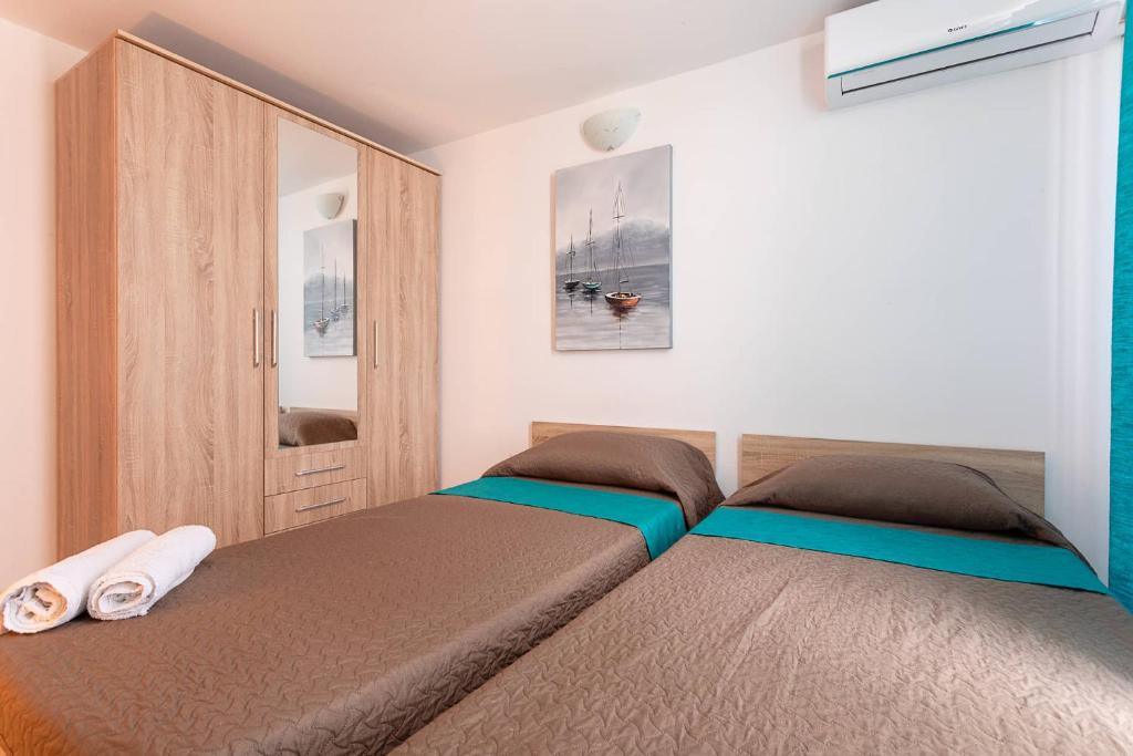 Postel nebo postele na pokoji v ubytování Belvedere Airport Suites