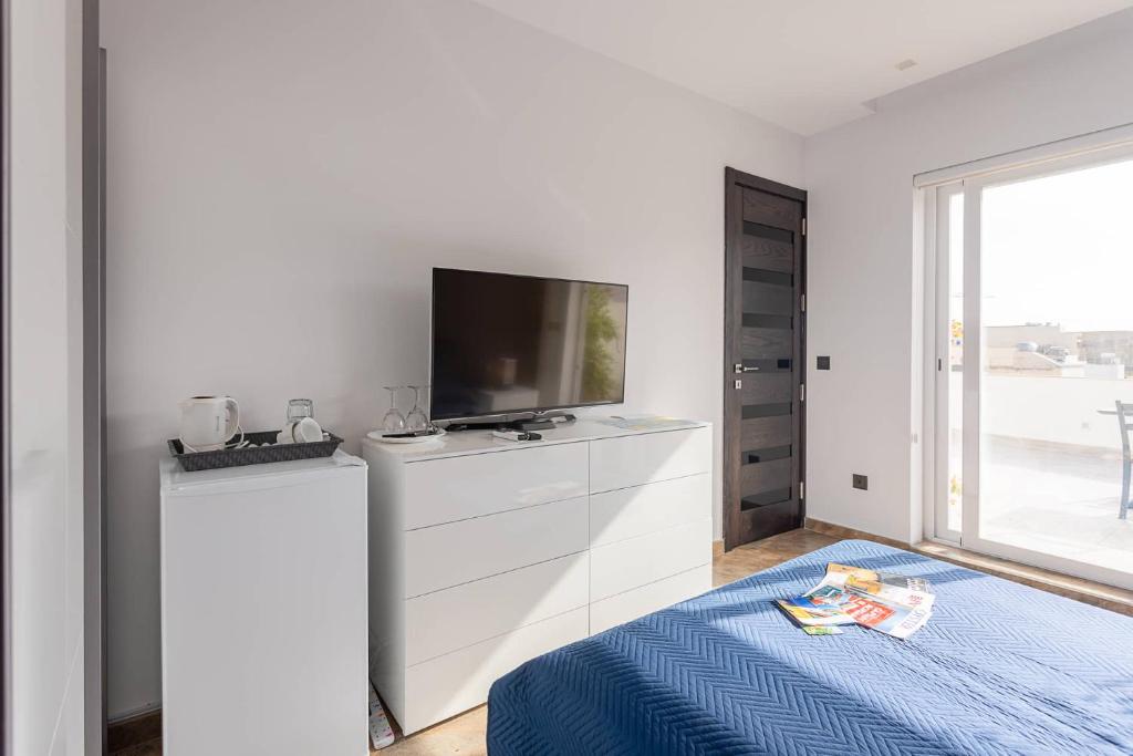 Postel nebo postele na pokoji v ubytování Belvedere Airport Suites