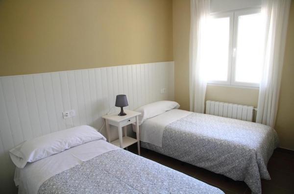 Posteľ alebo postele v izbe v ubytovaní Apartamentos Turísticos Rurales Monte de las Ánimas