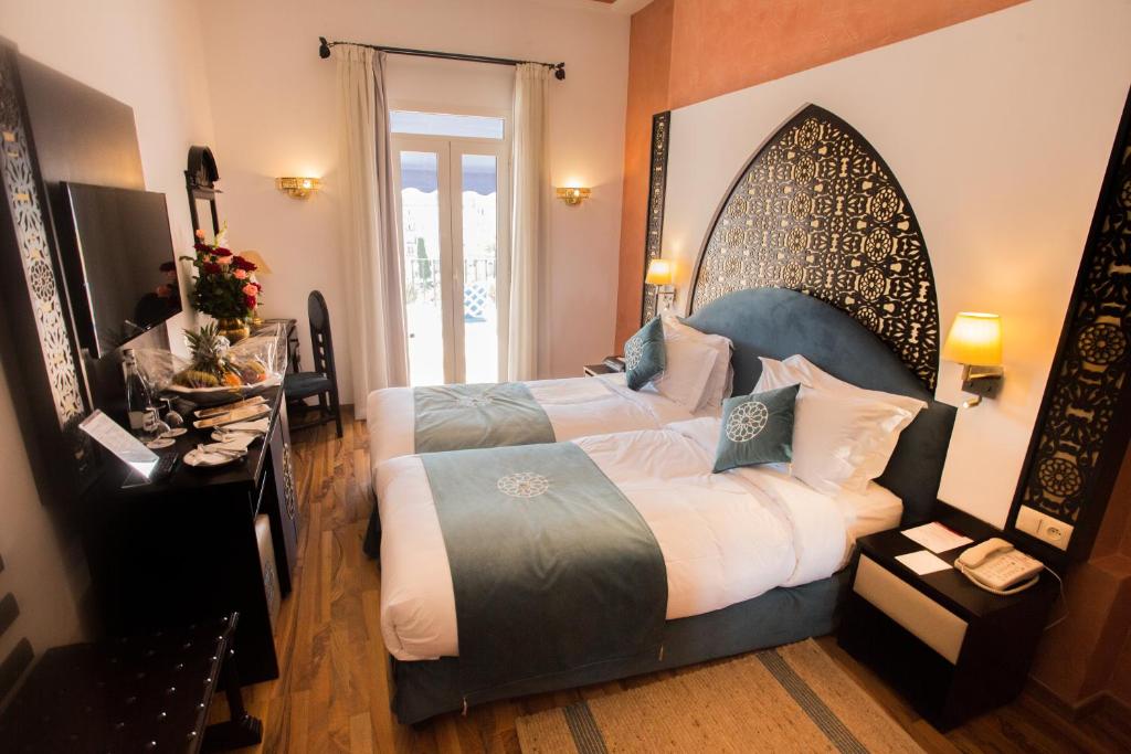 Voodi või voodid majutusasutuse El Minzah Hotel toas