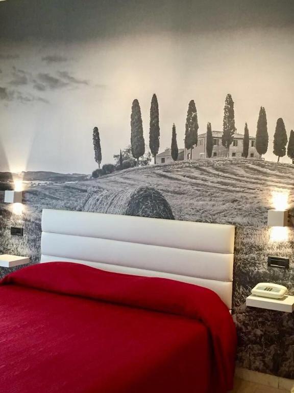 Postel nebo postele na pokoji v ubytování Grand Hotel Ambasciatori Wellness & Spa