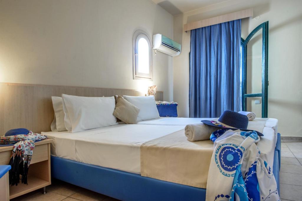 Postel nebo postele na pokoji v ubytování Pela Maria Hotel