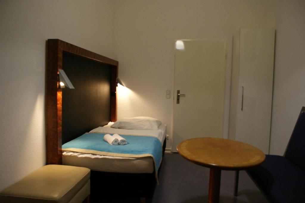 Postel nebo postele na pokoji v ubytování Hotel Garni Aaberna