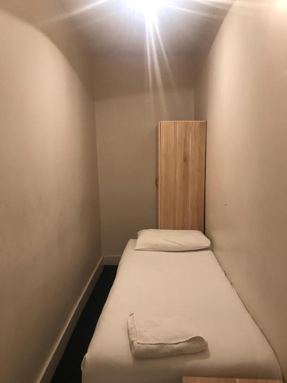 Postel nebo postele na pokoji v ubytování Aquarius Hotel