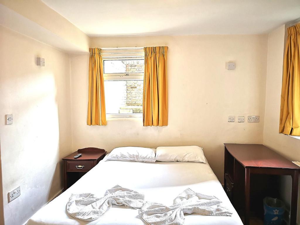 Postel nebo postele na pokoji v ubytování Aquarius Hotel
