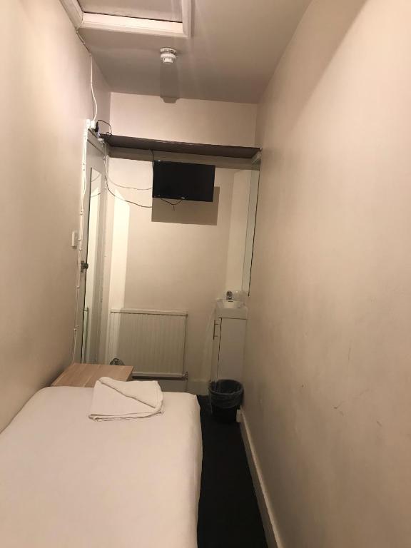 Postel nebo postele na pokoji v ubytování Aquarius Hotel