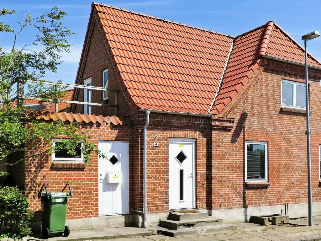 a brick house with an orange roof at Two-Bedroom Holiday home in Lemvig 5 in Lemvig