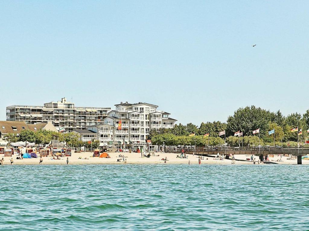 a view of a beach with condos in the background at Two-Bedroom Holiday home in Großenbrode 13 in Großenbrode