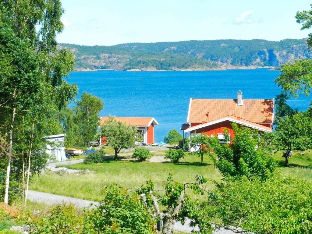 a house with a view of a lake at Holiday home BRASTAD V in Brastad