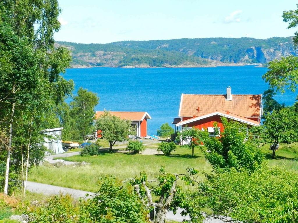 a house with a view of a lake at 6 person holiday home in BRASTAD in Brastad