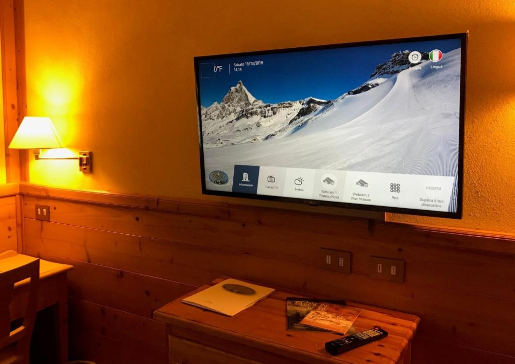 TV a/nebo společenská místnost v ubytování Hotel Mignon