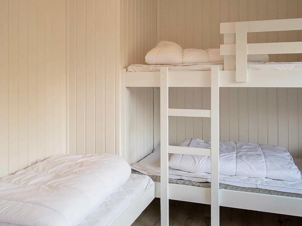 Postel nebo postele na pokoji v ubytování 10 person holiday home in Jerup-By Traum