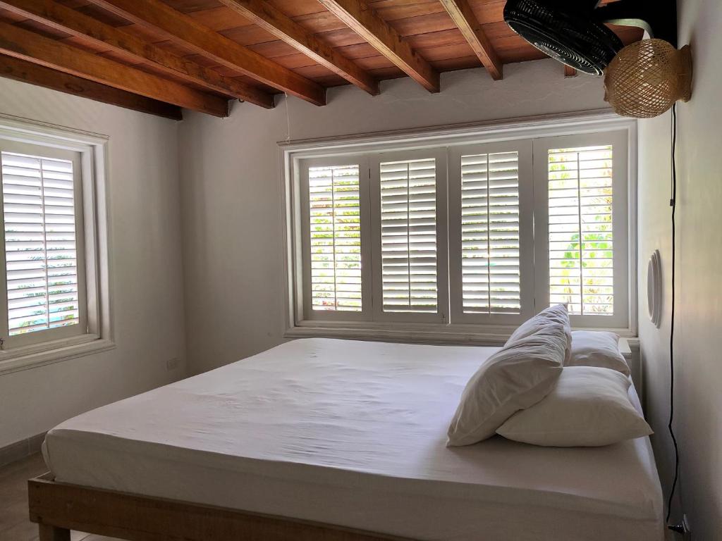 Postel nebo postele na pokoji v ubytování Hostal Secreto
