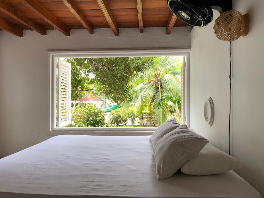Postel nebo postele na pokoji v ubytování Hostal Secreto