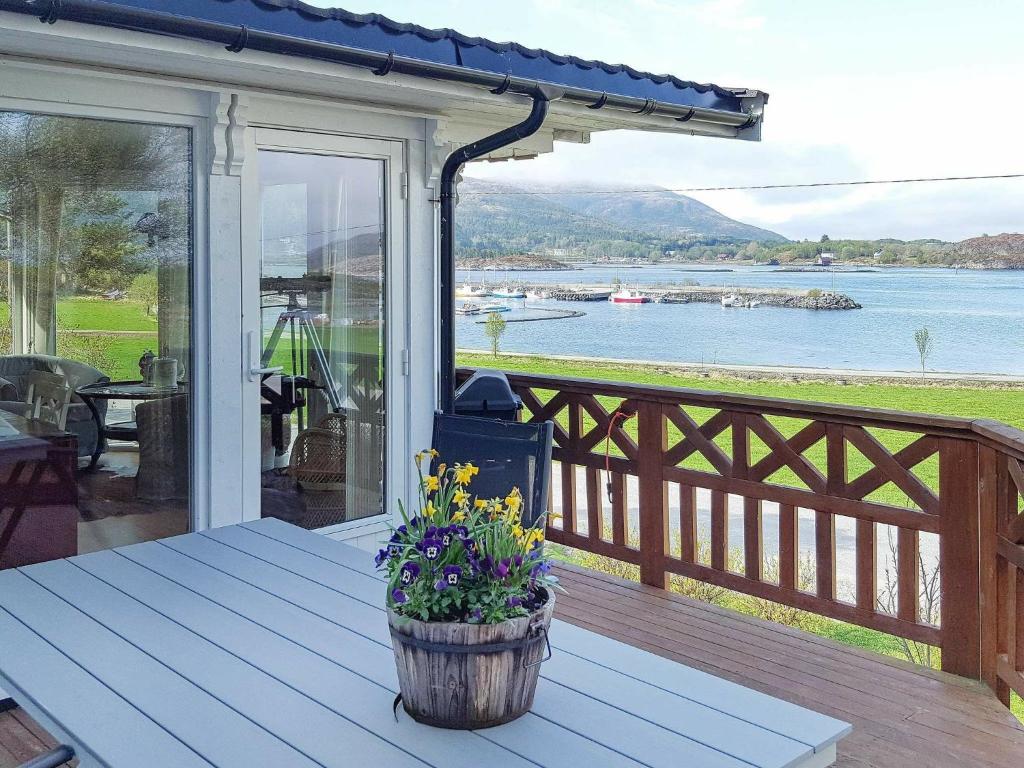 a porch of a house with a view of the water at 11 person holiday home in kolvereid in Kolvereid