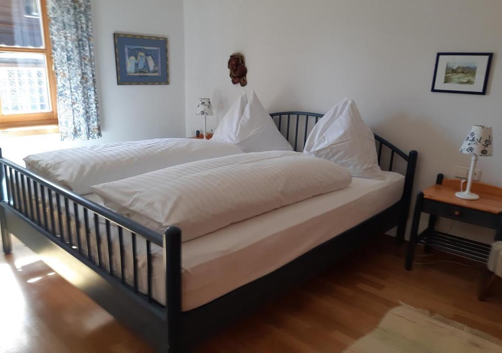 Posteľ alebo postele v izbe v ubytovaní Apartments Pfeffermühle - Kärnten Card im Sommer inklusive