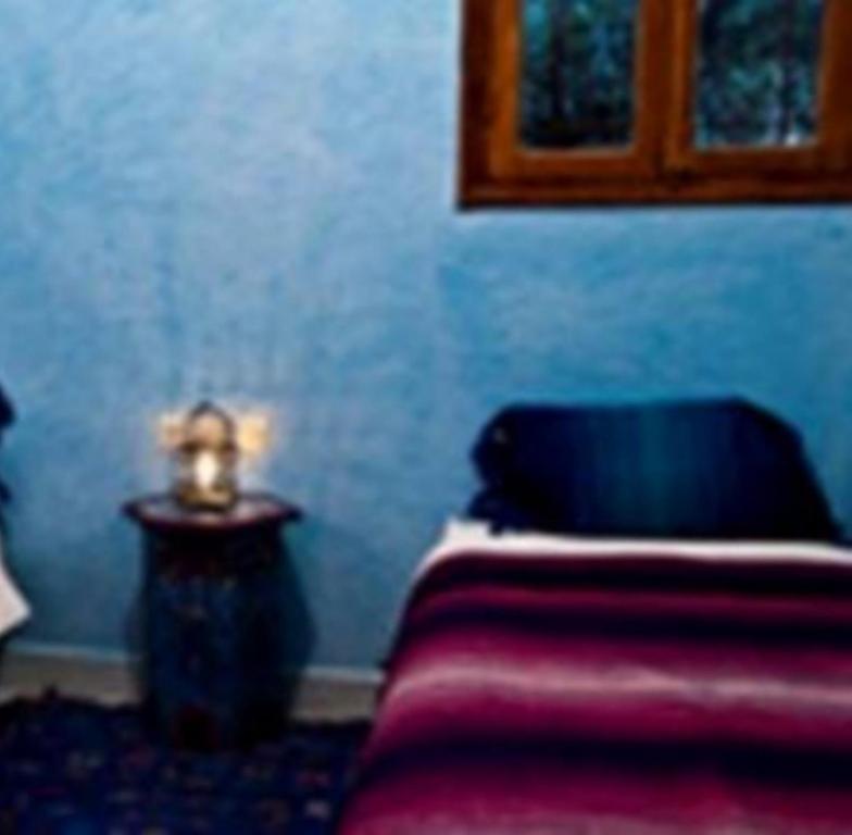 Postel nebo postele na pokoji v ubytování Hôtel Chellal ďOuzoud