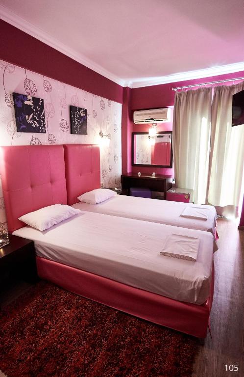 Postel nebo postele na pokoji v ubytování Atlantic Hotel