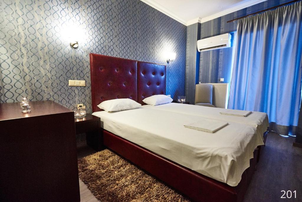 Postel nebo postele na pokoji v ubytování Atlantic Hotel