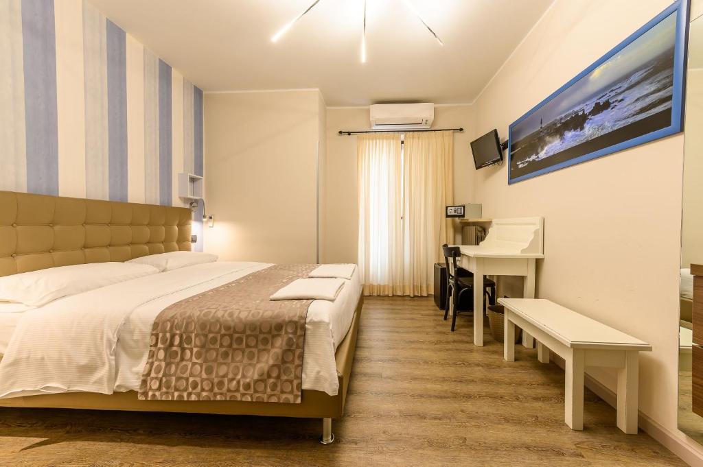 Postel nebo postele na pokoji v ubytování Hotel & Apartments " Perpoin "