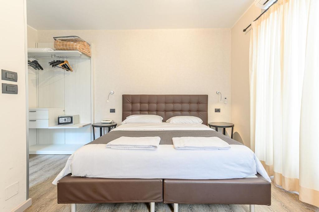 Postel nebo postele na pokoji v ubytování Hotel & Apartments " Perpoin "