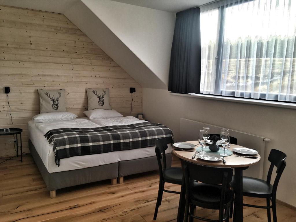 Postel nebo postele na pokoji v ubytování Apartmán Bambi Kvilda