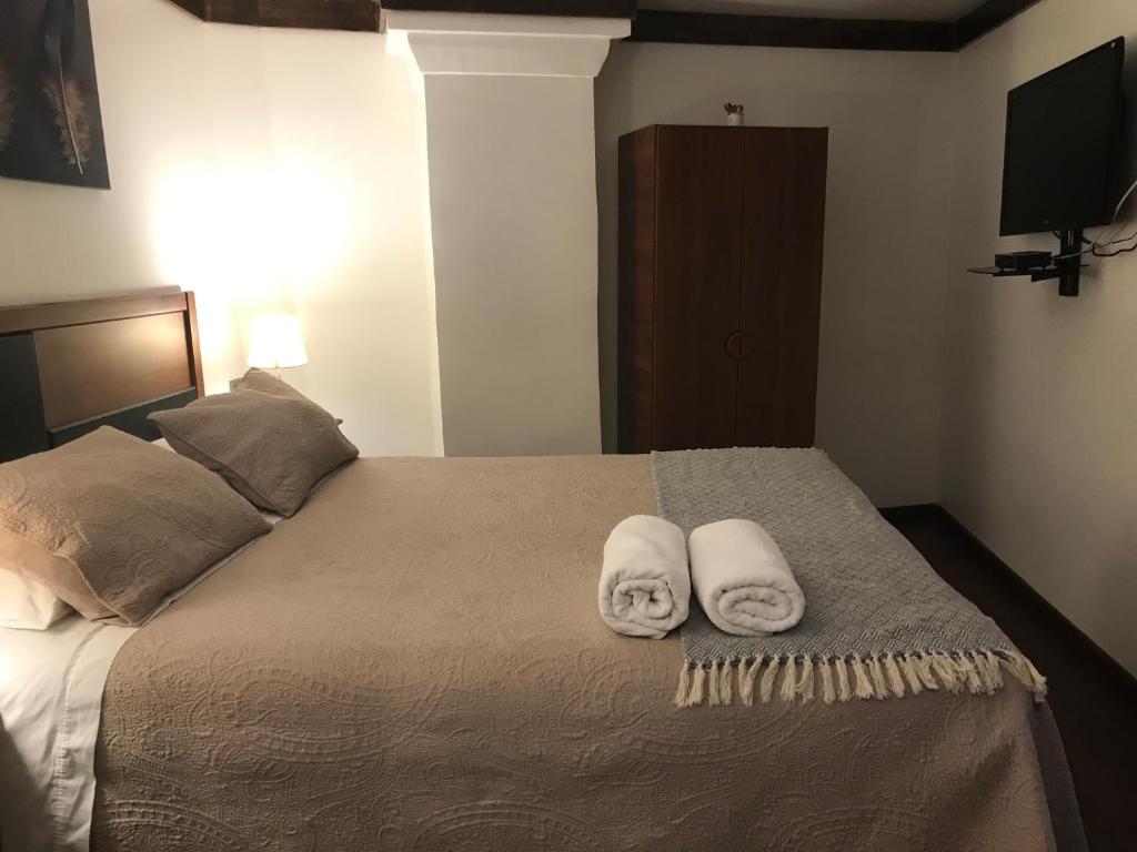 Postel nebo postele na pokoji v ubytování Lucia Agustina Hotel Boutique