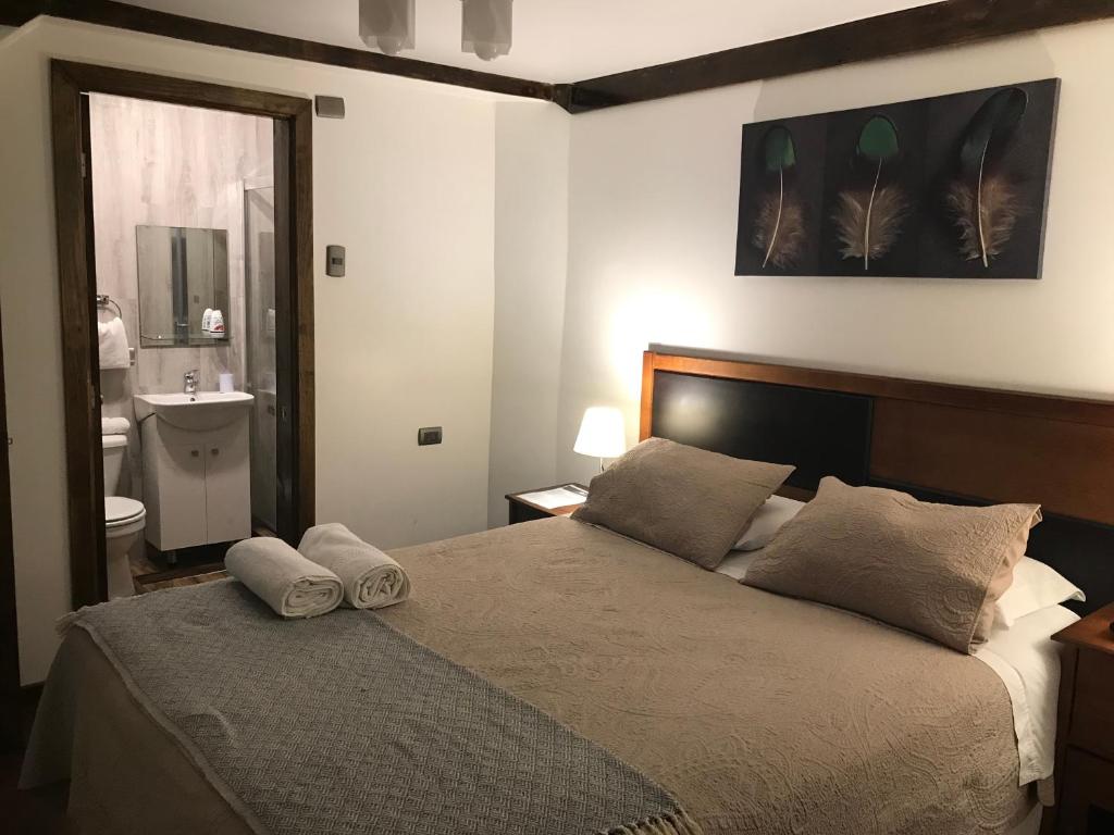Una cama o camas en una habitación de Lucia Agustina Hotel Boutique