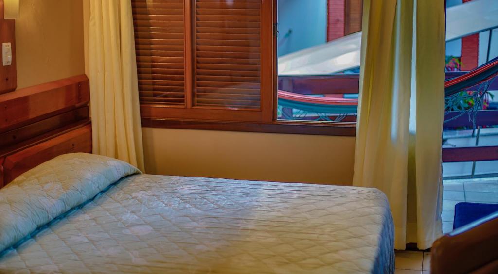 Postel nebo postele na pokoji v ubytování Costa Cabralia Hotel