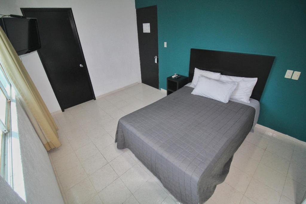 Postel nebo postele na pokoji v ubytování EMS Hoteles Boca del Río
