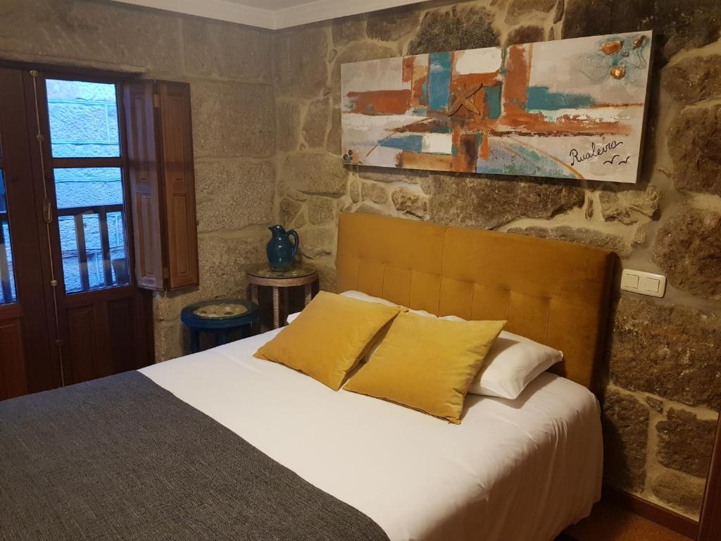 Postel nebo postele na pokoji v ubytování Casa Rualeira