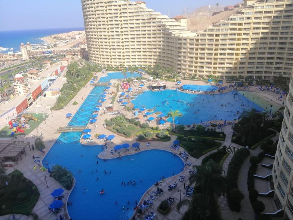 an aerial view of a resort with blue pools at Chalets at Pyramids Porto Sokhna by Easy Rent 2 in Ain Sokhna