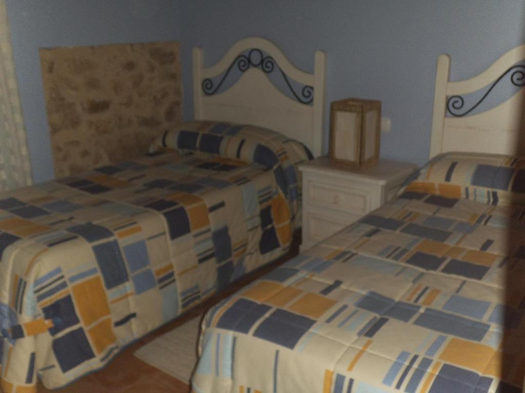 Postel nebo postele na pokoji v ubytování Apartamentos Casa La Cuca