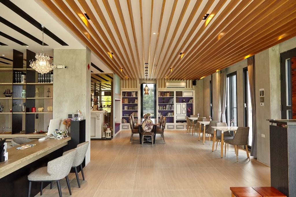 a restaurant with tables and chairs in a room at 菈芙卡LaFika in Dongshan